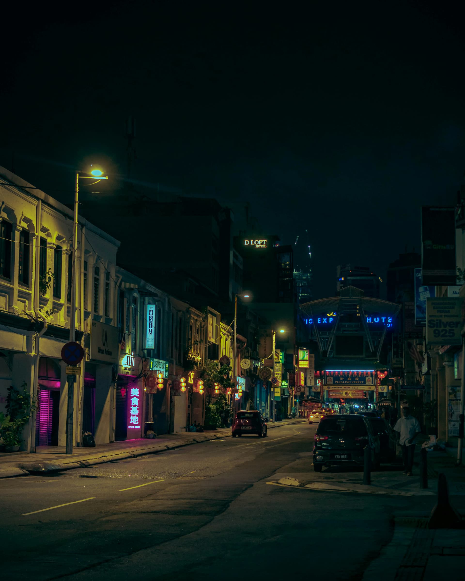 Nighttime street scene in Little Havana with people outside Ball & Chain